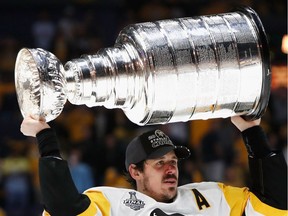 Evgeni Malkin of the Pittsburgh Penguins celebrates with the Stanley Cup Trophy after they defeated the Nashville Predators 2-0 in Game Six of the 2017 NHL Stanley Cup Final at the Bridgestone Arena on June 11, 2017 in Nashville, Tenn.