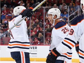 GLENDALE, AZ - JANUARY 12:  Darnell Nurse #25 of the Edmonton Oilers celebrates with Leon Draisaitl #29 and Patrick Maroon #19 after scoring a goal against the Arizona Coyotes during the third period of the NHL game at Gila River Arena on January 12, 2018 in Glendale, Arizona. The Oilers defeated the Coyotes 4-2.