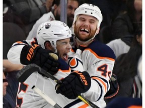 LAS VEGAS, NV - JANUARY 13: Darnell Nurse #25 and Zack Kassian #44 of the Edmonton Oilers celebrate after Nurse scored an overtime goal against the Vegas Golden Knights to win their game 3-2 at T-Mobile Arena on January 13, 2018 in Las Vegas, Nevada.