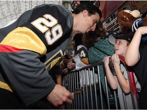 Marc-Andre Fleury #29 of the Vegas Golden Knights talks to a young fan on the red carpet at the Vegas Golden Knights Fan Fest at the Fremont Street Experience on January 14, 2018 in Las Vegas, Nevada.
