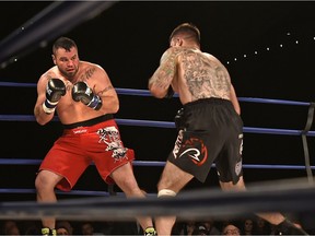 Adam Braidwood fighting Tim Hague (left) during the KO 79 boxing event at the Shaw Centre in Edmonton, June 16, 2017.