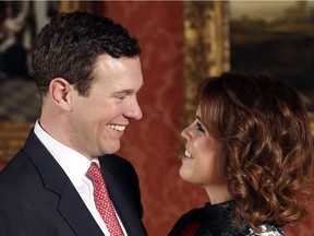 Britain's Princess Eugenie and Jack Brooksbank pose for the media in the Picture Gallery at Buckingham Palace after they announced their engagement in London, Monday, Jan. 22, 2018.