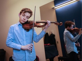 Violinist Jacques Forestier, 13, plays for Mount Royal Conservatory violin instructor William van der Sloot during a lesson in Calgary on Monday, Jan. 15, 2018. Forestier is the sole Canadian to make it into the international Menuhin Competition, which he describes as being like the Olympics of violin competitions.
