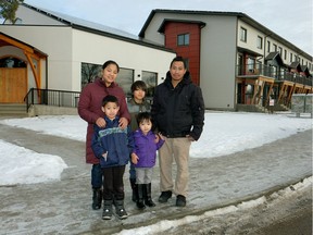 Hsar Keelar and husband Pran Htoo with three of their five children, Anna, John and Soesaytaw. They live in North Glenora in a five-bedroom unit with her parents.