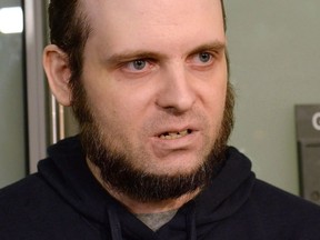 A lawyer for a Canadian man recently freed with his wife and children after years of being held hostage in Afghanistan says his client has been arrested and faces at least a dozen charges. Joshua Boyle speaks to members of the media at Toronto's Pearson International Airport on Friday, October 13, 2017. Boyle faces charges including sexual assault, assault and forcible confinement.