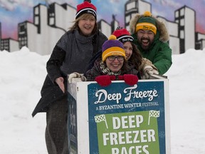 Christy Morin (left) and  Jon Jon Rivero (right) push Amy Langille (front) and Meaghan Underhill (back) in a deep freezer during a press conference for the11th Annual Deep Freeze, a Byzantine Winter Festival on Tuesday, Jan. 9, 2018 in Edmonton. The festival runs from January 13-14.