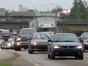 Vehicles travel in the eastbound lane of Yellowhead Highway in Edmonton, Alta.
