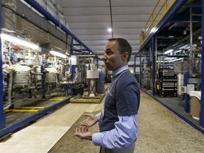 A Field Upgrading engineer shows off the company's Fort Saskatchewan pilot plant during a tour in June 2016.