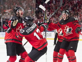 Canada forward Tyler Steenbergen (17) celebrates his game winning goal with teammate Conor Timmins (3) during the third period of the gold medal final IIHF World Junior Championships hockey action in Buffalo, N.Y., on Friday, January 5, 2018.