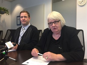 Consultant Wade King, left, and Edmonton city manager Linda Cochrane address members of the media on Jan. 11, 2018.  Cochrane seconded King from the University of Alberta for one year to help address issues of harassment in the workplace.