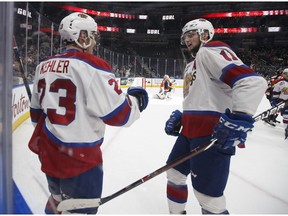 Edmonton's Colton Kehler (23) celebrates a goal with teammate Tomas Soustal (11) during the first period of a WHL game between the Edmonton Oil Kings and the Medicine Hat Tigers at Rogers Place on Wednesday, Jan. 24, 2018.