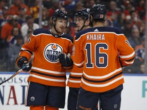 Edmonton's Oscar Klefbom (77) chats with Brandon Davidson (88) and Jujhar Khaira (16) during the second period of a NHL game between the Edmonton Oilers and the Calgary Flames at Rogers Place in Edmonton, Alberta on Thursday, Jan. 25, 2018.