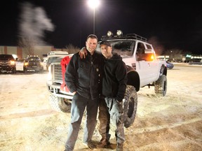 Friends Marty Frost and Blair Watson pose for a photo in front of Frost's truck on Sunday, Jan. 7, 2018. The F350's engine was rebuilt to surprise and thank Frost for his charitable work in the community.