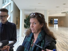 Nadine Swist, a former Edmonton Police Service constable, says she was harassed and went unsupported when she developed PTSD after being thrown out of a car by a suspect. She spoke to media after an Edmonton Police Commission meeting on Jan. 18, 2018.