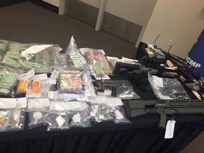 Strathcona County RCMP drug unit made a record seizure following a drug trafficking investigation that began in November 2017. Mounties seized large amounts of drugs, drug trafficking paraphernalia, a handgun, shotgun, two Edmonton Police Service vests, ammunition, an operational signal jammer, and approximately $442,875 in cash from two homes ó on in Sherwood Park and one in Leduc County. RCMP handout