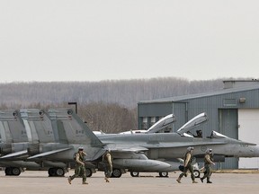 Military pilots are seen in Cold Lake in this file photo. A Canadian Forces corporal in Cold Lake pleaded guilty Tuesday to a charge stemming from making a false insurance claim.