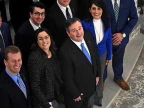 United Conservative Party Leader Jason Kenney, centre front, poses for pictures with MLAs and party officials after being sworn in as MLA for Calgary-Lougheed in the chamber at the Alberta legislature in Edmonton on Monday, Jan. 29, 2018.
