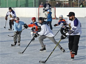 Edmonton downtown division police officers laced up their skates for a friendly game of hockey with youth from the neighbourhood for the 9th annual McCauley Cup at the McCauley ice rink in downtown Edmonton on Thursday, Jan. 4, 2018. The game was introduced to bridge the gap between police and the community.