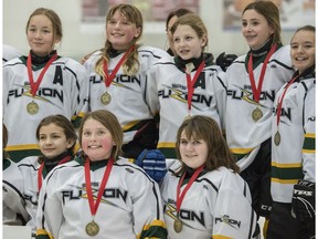 PeeWee SP812 Fusion smile for family photographs after their overtime win over Beaumont in the championship game of the Quickcard Minor Hockey Week at Terwiligar Rec Centre on January 21, 2018 in Edmonton.