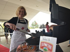 Premier Rachel Notley barbecues meats at a joint energy and agriculture reception in Tokyo on April 26, 2017, to raise the profile of Alberta energy and agri-food products like Alberta beef and pork, in Japan.