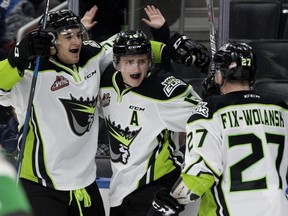 The Edmonton Oil Kings celebrate Davis Koch's (16) game winning goal against the Calgary Hitmen during third period WHL action at Rogers Place in Edmonton Monday, Jan. 1, 2018.