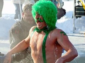 Canadian soldier Eli Duvall jumps into the frigid waters of Lake Summerside in Edmonton on Sunday January 28, 2018. Approximately 200 people participated in the Edmonton Polar Plunge at Lake Summerside to raise money for Special Olympics Alberta. The temperature at the time was hovering around -20C degrees.