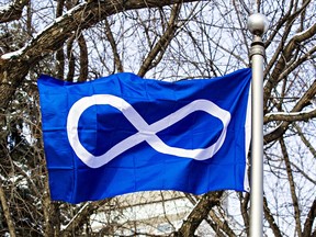 The Metis flag flies during a Metis Week ceremony at City Hall in Edmonton, Alta., on Monday, Nov. 10, 2014.