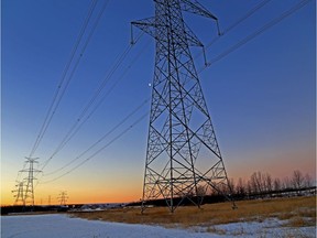 Dawn breaks over power lines in Edmonton.