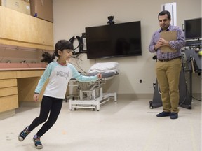 Thaer Manaseer, PhD student in the  Faculty of Rehabilitation Medicine used his daughter Amril, 7, to demonstrate some of the exercises.