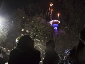 Many Edmonton residents ran in the New Year watching Calgary's fireworks display on TV after Edmonton decided to light the fuse three hours early.