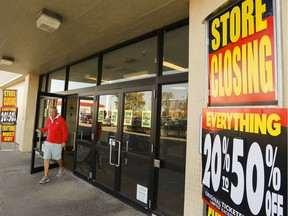 A shopper exits Sears Canada store on Friday Oct. 20, 2017 at Lansdowne Place mall in Peterborough, Ont. File photo.