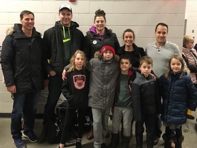 Former U of A Golden Bears and Pandas players gather with their kids at Quikcard Minor Hockey week in Edmonton on Friday, Jan. 19, 2018. Parents: (left to right) Jesse Douglas, Gavin McLeod, Tawana McLeod, Karin Lechuk and Clayton Miles (son plays on another SWAT team). Kids: (left to right) Keiran Douglas, Layne McLeod, Finn Lechuk, Kalen Miles.