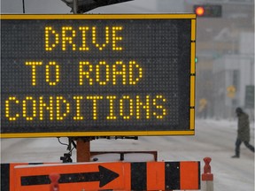 Road signs have been set up around the city reminding drivers about winter driving conditions in Edmonton on Tuesday Jan. 9, 2018.