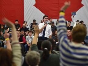 There was no shortage of hands up for questions as Prime Minister Justin Trudeau answers questions at his cross country town hall meeting at MacEwan University in Edmonton, February 1, 2018.