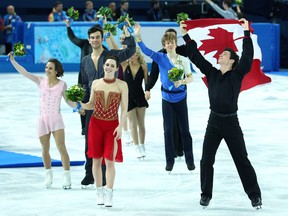 Canada celebrates their silver medal in the figure skating team event at the Sochi Olympics on Feb. 9, 2014.