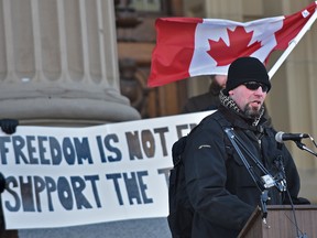 Former MCpl Chance Burles speaks at the Veterans left in the cold rally in solidarity with Colin Saunders “left in the cold” protest in Ottawa, after the Prime Minister stated that we as veterans are asking for to much as supporters rallied together across many other cities in Canada and at the front steps of the Alberta Legislature in Edmonton, February 15, 2018. Ed Kaiser/Postmedia