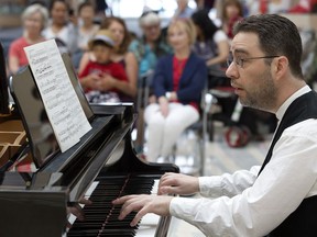 Jason Cutmore performs during the kickoff for Alberta Pianofest at City Hall, in Edmonton Thursday July 6, 2017.
