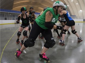 Members of the E-Ville Roller Derby League practice at the Edmonton Sports Dome, 10104 32 Ave., in Edmonton Thursday July 20, 2017.