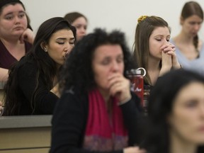 Attendees listen to a prayer song prior to the start of an educational forum at MacEwan University in Edmonton on Tuesday, Feb. 13, 2018, about the killing of Colten Boushie.