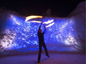 Flow performer Geoff Brockelsby juggles fire inside the Hawrelak Park Ice Castle during the Silver Skate Festival in Edmonton Sunday Feb. 18, 2018.