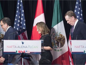 Foreign Affairs Minister Chrystia Freeland leaves the stage with United States Trade Representative Robert Lighthizer, right, and Mexico's Secretary of Economy Ildefonso Guajardo Villarrea after delivering statements to the media during the sixth round of negotiations for a new North American Free Trade Agreement in Montreal, Monday, January 29, 2018.
