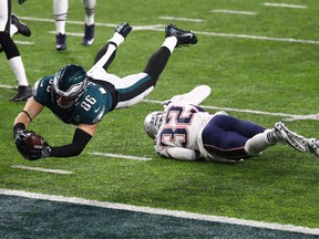 Philadelphia Eagles tight end Zach Ertz (left) scores a fourth-quarter touchdown against the New England Patriots in Super Bowl LII on Feb. 4.