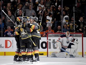 LAS VEGAS, NV - FEBRUARY 15:  The Vegas Golden Knights celebrate after Ryan Carpenter #40 scored a goal against Cam Talbot #33 of the Edmonton Oilers in the first period of their game at T-Mobile Arena on February 15, 2018 in Las Vegas, Nevada.