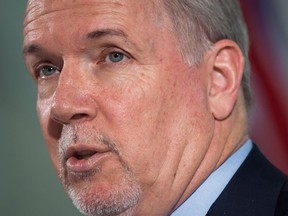 Premier John Horgan says he plans to intensify efforts to find new markets for B.C. wine, which was already being done before Alberta's ban over the Trans Mountain pipeline. British Columbia Premier John Horgan responds to questions during a news conference in Vancouver on Friday, February 2, 2018.