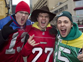 Ryan Rollier, left, Colin Dorchak and Graham Sucha get pumped for the game during Grey Cup game day festivities at Churchill Square in Edmonton on Nov. 28, 2010. The 2018 Grey Cup organizing committee announced details about this year's festivities Friday.