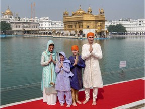 Canadian Prime Minister Justin Trudeau, right, his wife Sophie Gregoire Trudeau, left, their daughter Ella Grace, second left, and son Xavier greet in Indian style during their visit to Golden Temple, in Amritsar, India, Wednesday, Feb. 21, 2018. Trudeau is on a seven-day visit to India.