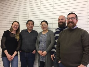 Genia Rodnyansky, left, Allan Yee, and Ray Ma of Honest Dumplings are working South Island Pie's Jamie Scott to open a provincial agri-food facility in the Oliver area of Edmonton. Chris LeRohl of Honest Dumplings is at the far right.