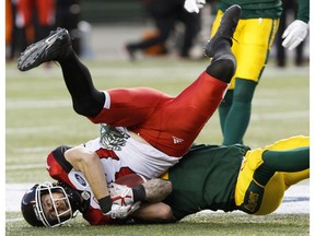 Calgary Stampeders receiver Rory Kohlert gets tackled by Edmonton Eskimos safety Neil King in Edmonton on Oct. 28, 2017. (File)