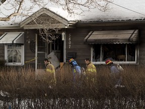Fie investigators inspect a fire that occurred at  5807 109 Street on Tuesday, Feb. 27, 2018  in Edmonton.