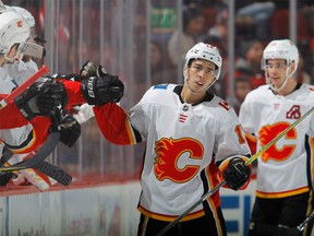 Johnny Gaudreau of the Calgary Flames celebrates his second period goal against the New Jersey Devils with his teammates on February 8, 2018 at Prudential Center in Newark, N.J.